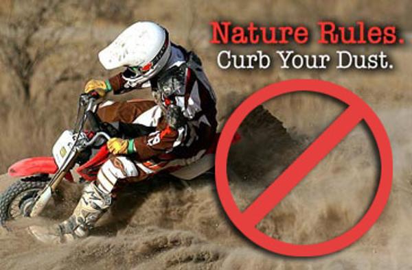 Curb Your Dust overlays a photo of a dirt biker